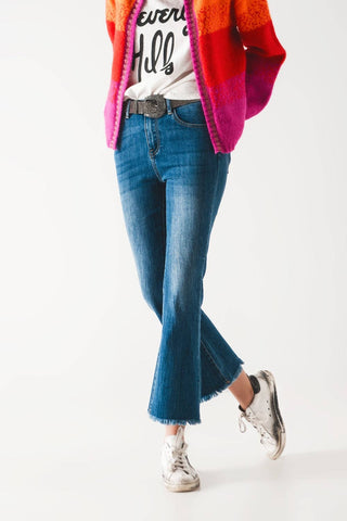 Flared jeans with raw edge in mid wash: Blue